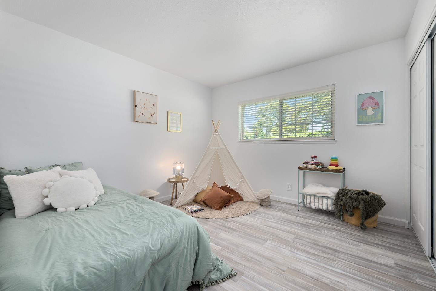 929 Maclay Drive San Jose, CA 95123 - Photo 15 of 23 a bedroom with a bed and a window