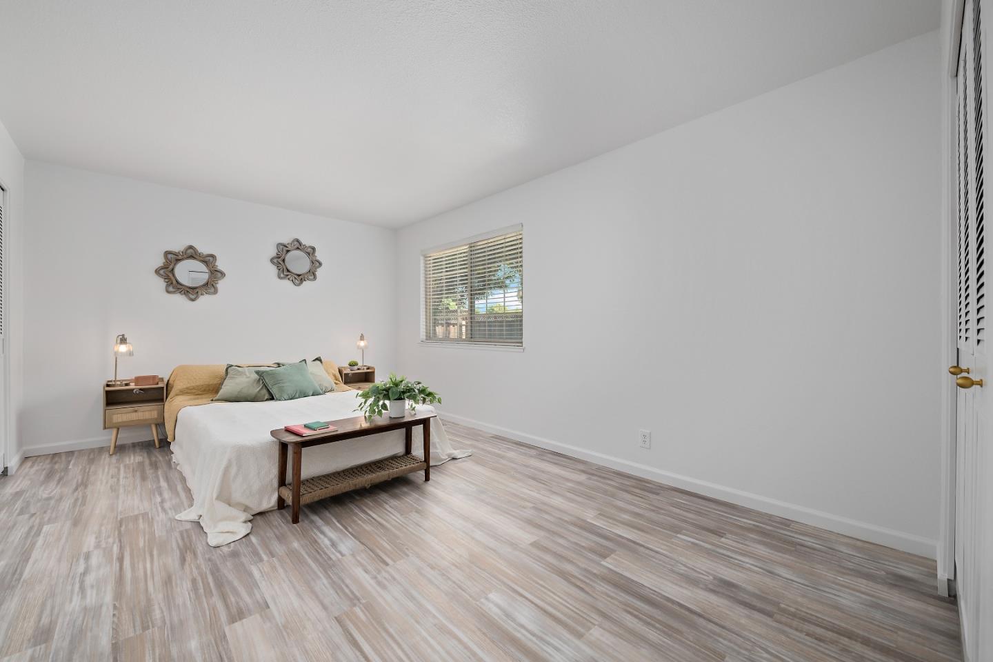 929 Maclay Drive San Jose, CA 95123 - Photo 17 of 23 a spacious bedroom with a bed and wooden floor