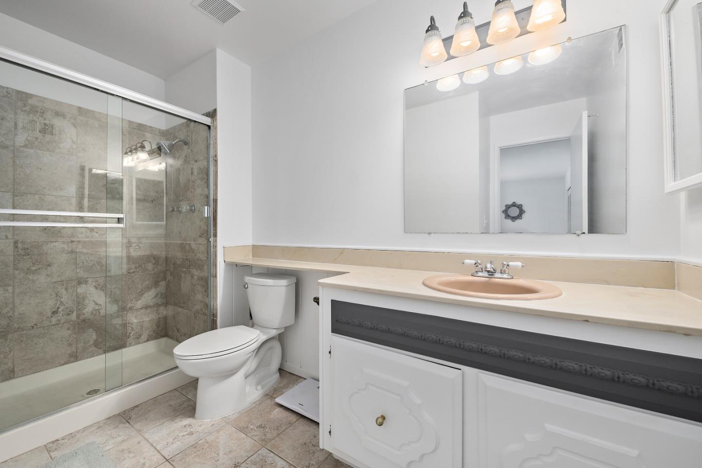 929 Maclay Drive San Jose, CA 95123 - Photo 20 of 23 a bathroom with a sink a toilet a mirror and shower