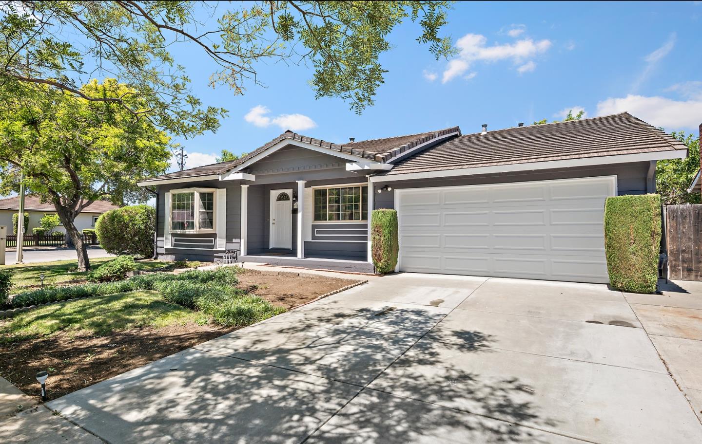 929 Maclay Drive San Jose, CA 95123 - Photo 2 of 23 a front view of a house with a garden and yard