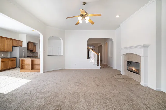 a bathroom with a granite countertop sink a toilet and a mirror