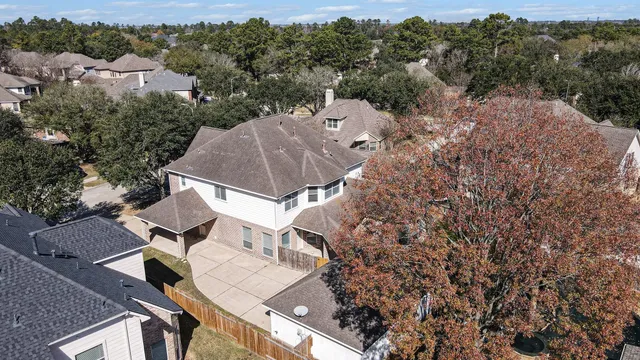 a kitchen with granite countertop a sink stainless steel appliances and cabinets