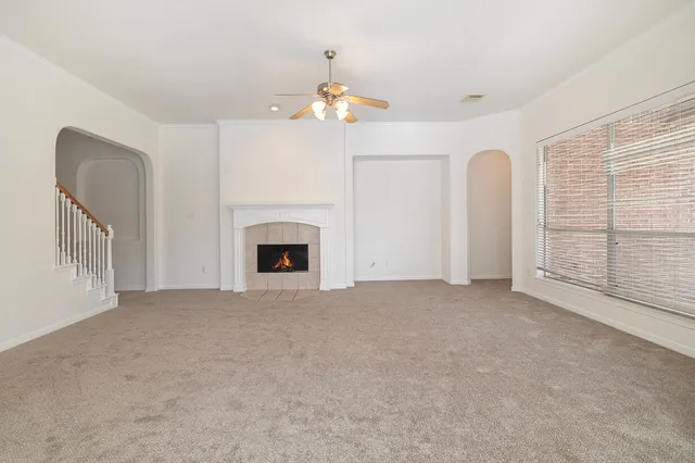 a view of empty room with a fireplace
