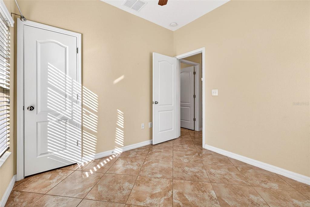 31253 Claridge Place Wesley Chapel, FL 33543 - Photo 19 of 37 an empty room with windows