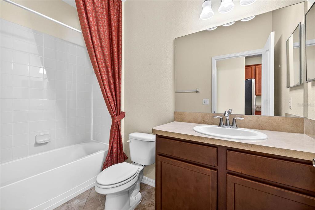 31253 Claridge Place Wesley Chapel, FL 33543 - Photo 20 of 37 a bathroom with a sink a toilet and a bathtub