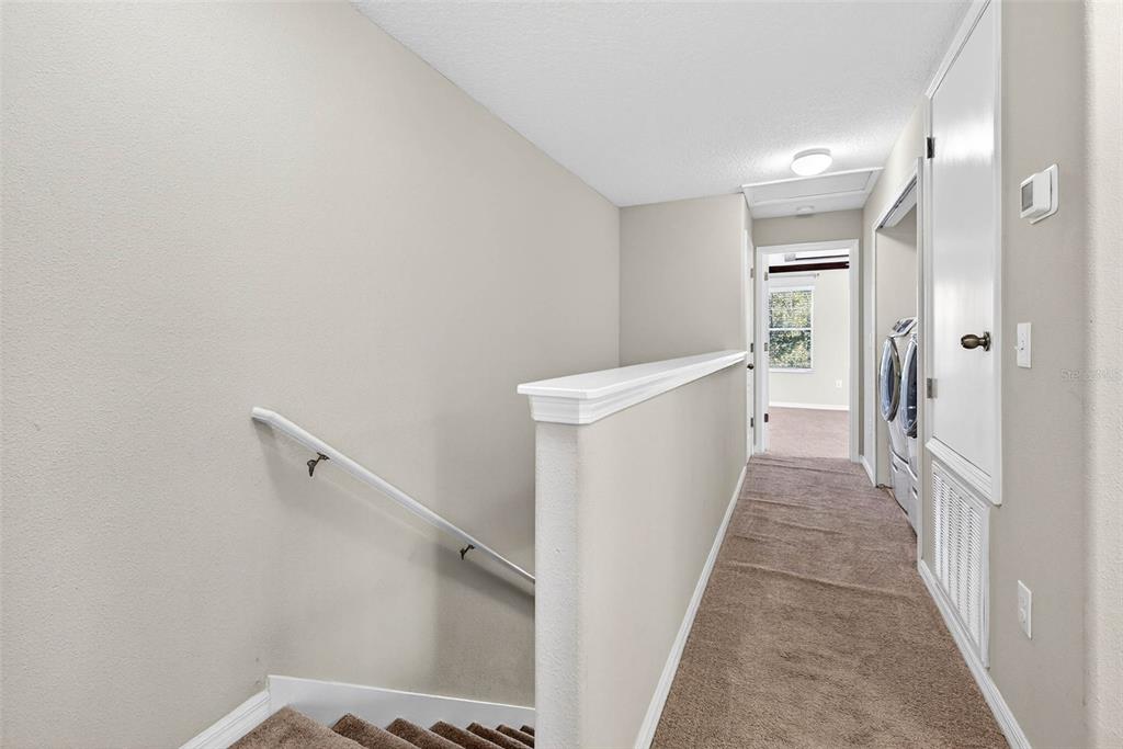 31253 Claridge Place Wesley Chapel, FL 33543 - Photo 21 of 37 a view of a hallway with white walls