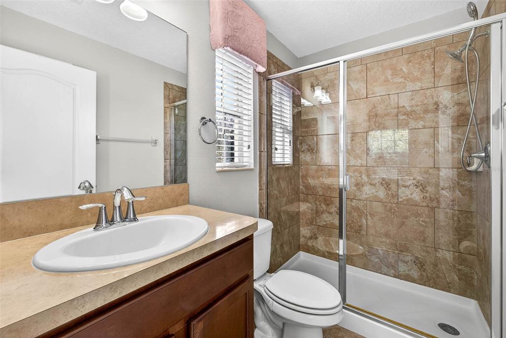 31253 Claridge Place Wesley Chapel, FL 33543 - Photo 27 of 37 a bathroom with a sink toilet and shower