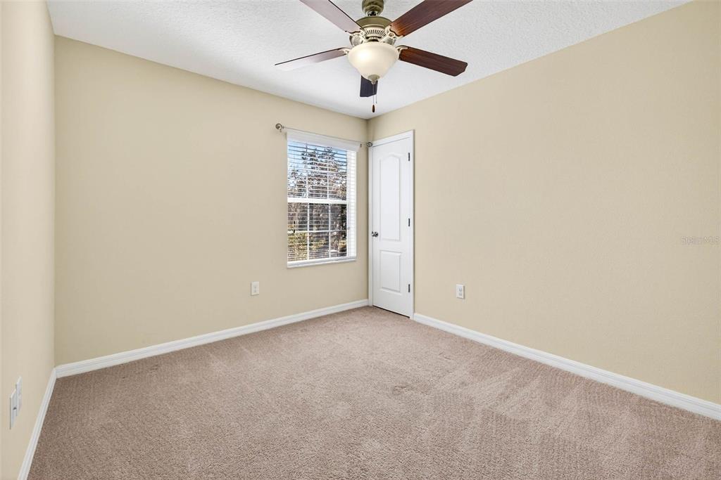 31253 Claridge Place Wesley Chapel, FL 33543 - Photo 28 of 37 an empty room with windows and fan