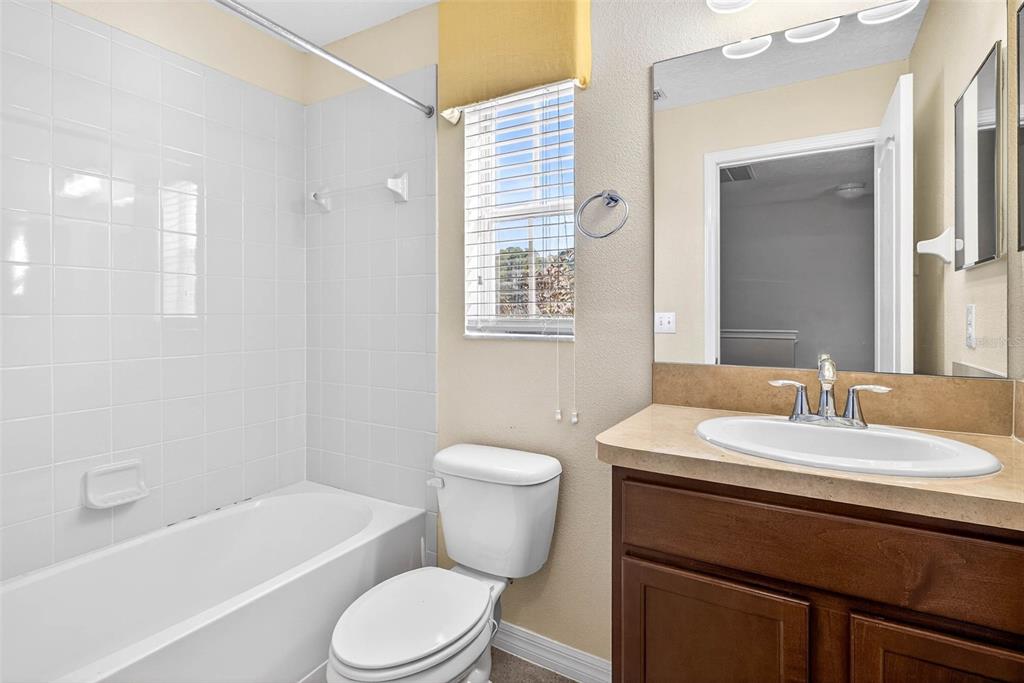 31253 Claridge Place Wesley Chapel, FL 33543 - Photo 32 of 37 a bathroom with a sink toilet vanity and bathtub