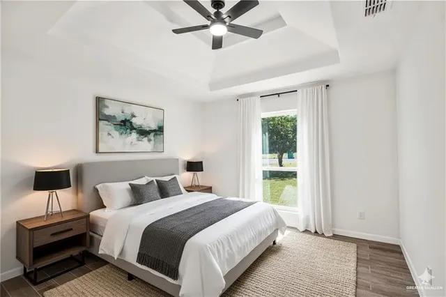 a bedroom with a large bed and a window