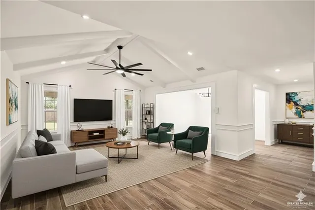a living room with furniture and a flat screen tv