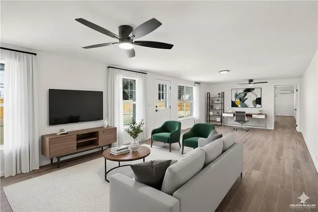 a living room with furniture and a flat screen tv