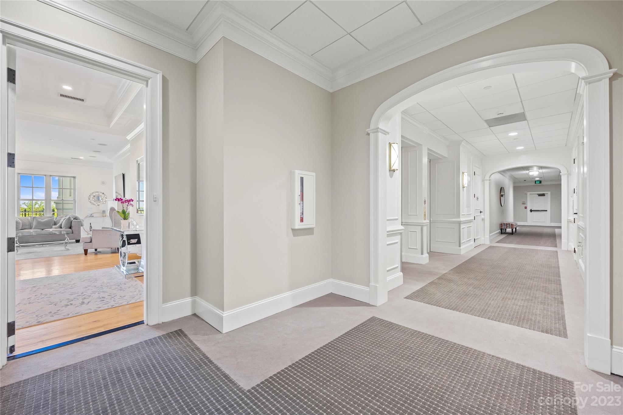 2823 Providence Road, Unit 174 Charlotte, NC 28211 - Photo 37 of 38 a view of a hallway with wooden floor and a living room