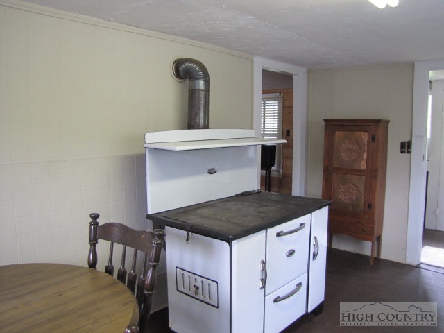1692 Rip Shin Road Lansing, NC 28643 - Photo 17 of 22 a kitchen with a stove and a refrigerator