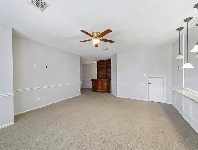 a bathroom with a sink a toilet and a large mirror