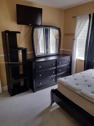 a bedroom with a bed and a closet