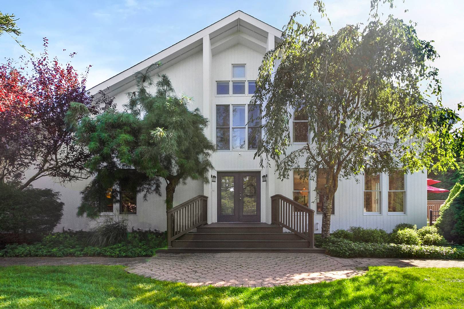 a front view of house with yard and green space