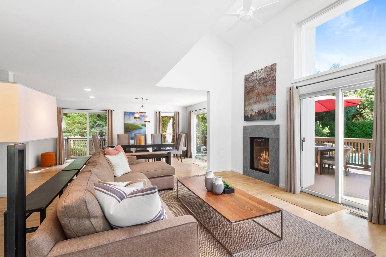 27 Tuthill Lane Remsenburg, NY 11960 - Photo 2 of 18 a living room with furniture and a fireplace
