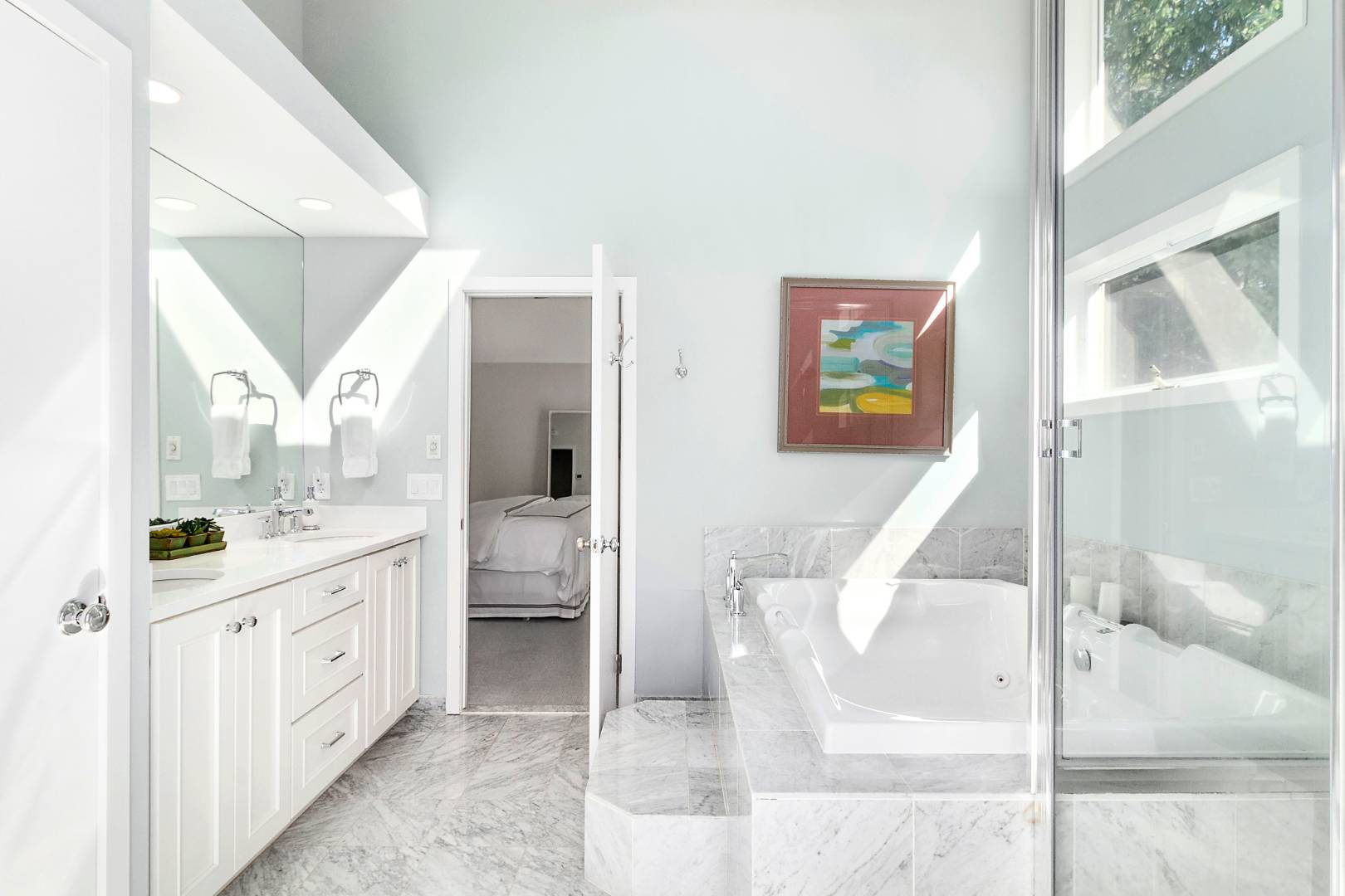 27 Tuthill Lane Remsenburg, NY 11960 - Photo 13 of 18 a bathroom with a double vanity sink and a mirror