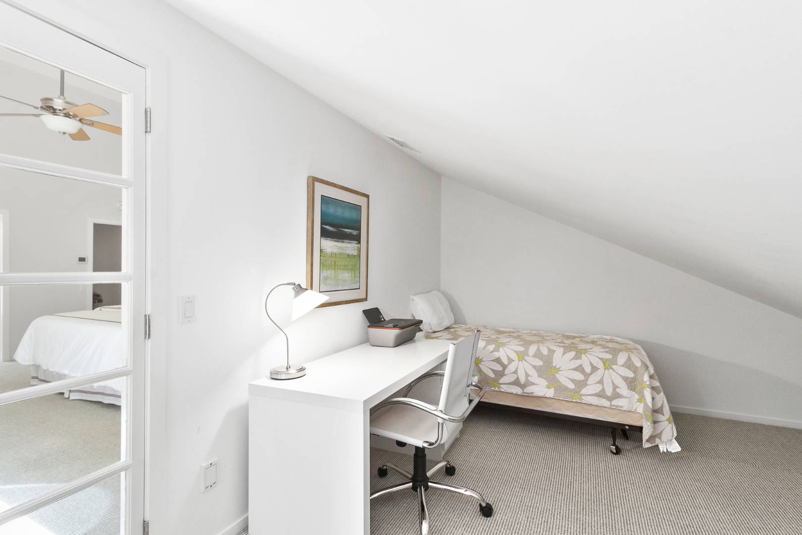 27 Tuthill Lane Remsenburg, NY 11960 - Photo 14 of 18 a bedroom with a bed and a table