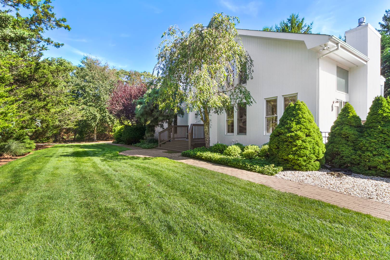 27 Tuthill Lane Remsenburg, NY 11960 - Photo 18 of 18 a front view of a house with a yard