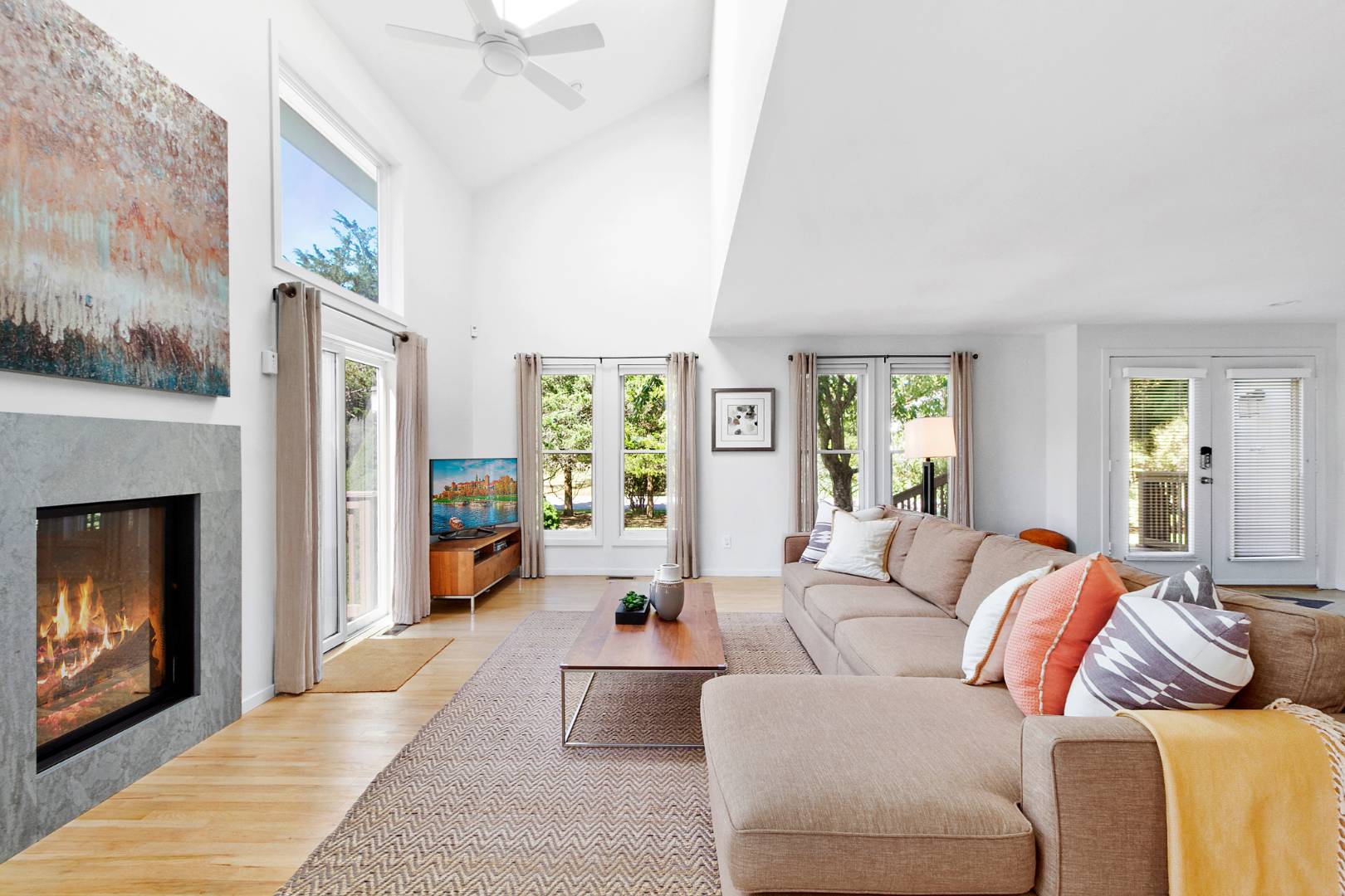 27 Tuthill Lane Remsenburg, NY 11960 - Photo 3 of 18 a living room with furniture and a fireplace