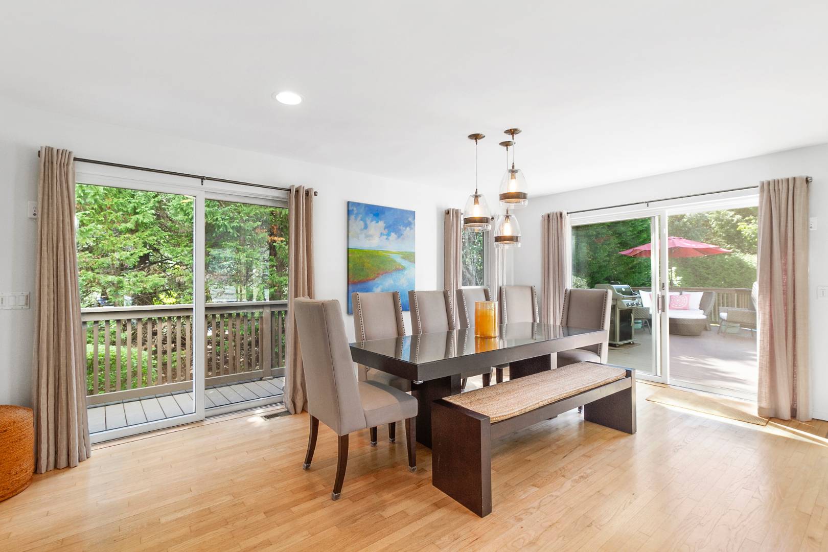 27 Tuthill Lane Remsenburg, NY 11960 - Photo 5 of 18 a living room with furniture large window and wooden floor