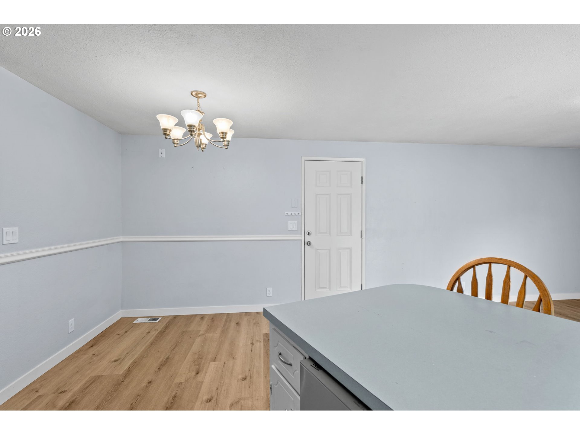 6445 B Street Springfield, OR 97478 - Photo 11 of 26 a view of a chandelier fan