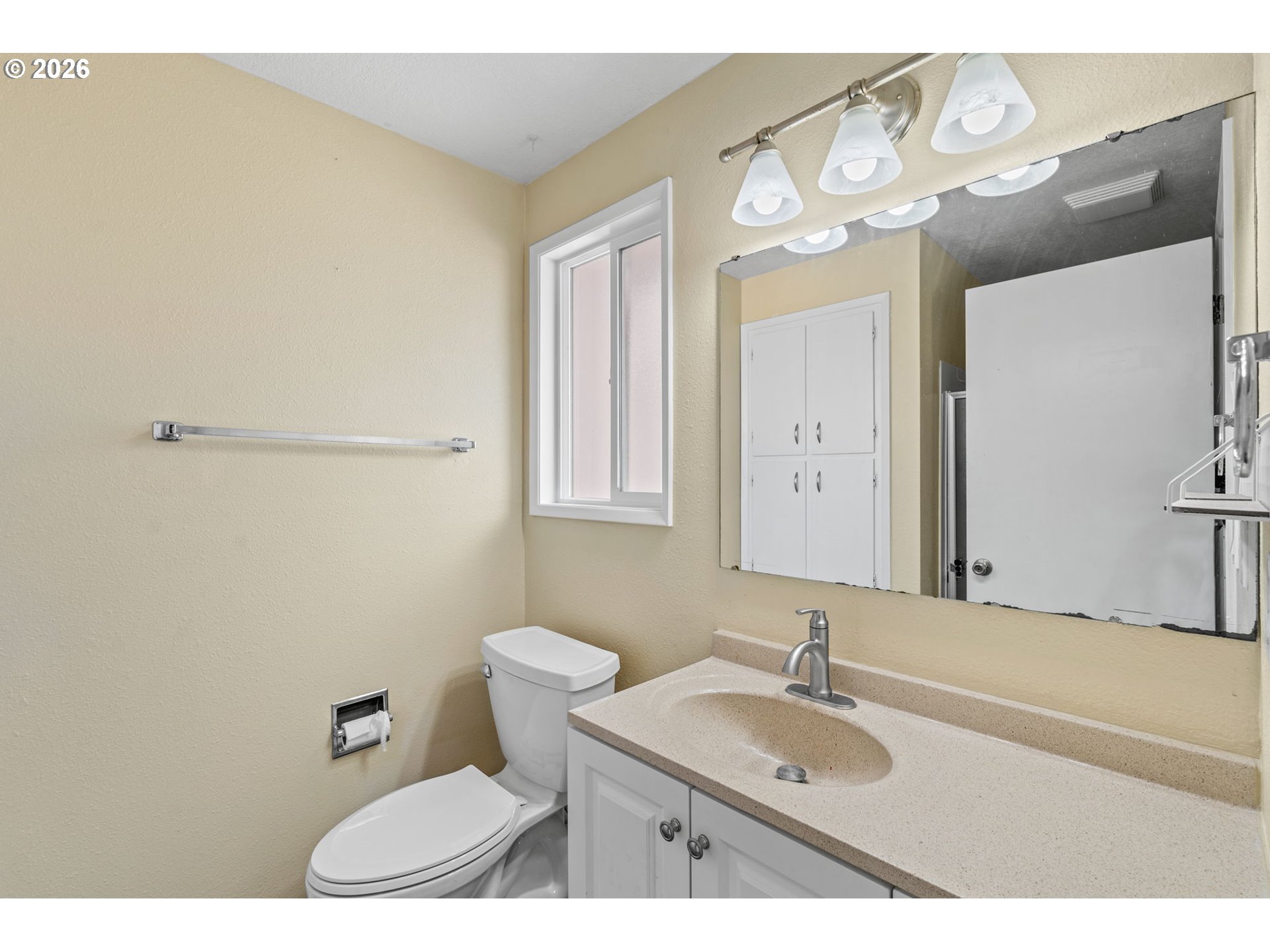 6445 B Street Springfield, OR 97478 - Photo 15 of 26 a bathroom with a sink and a mirror