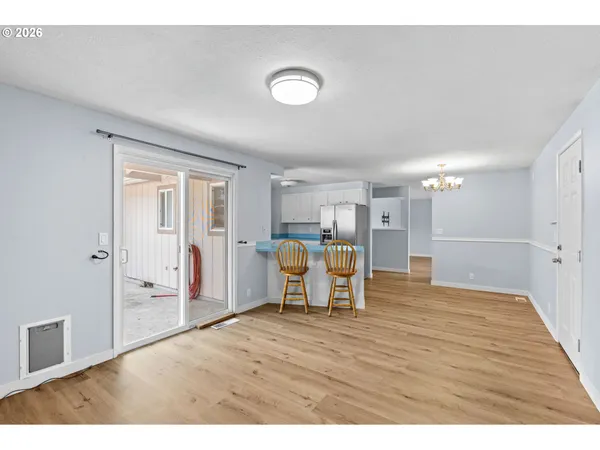 a view of a livingroom with furniture and a workspace