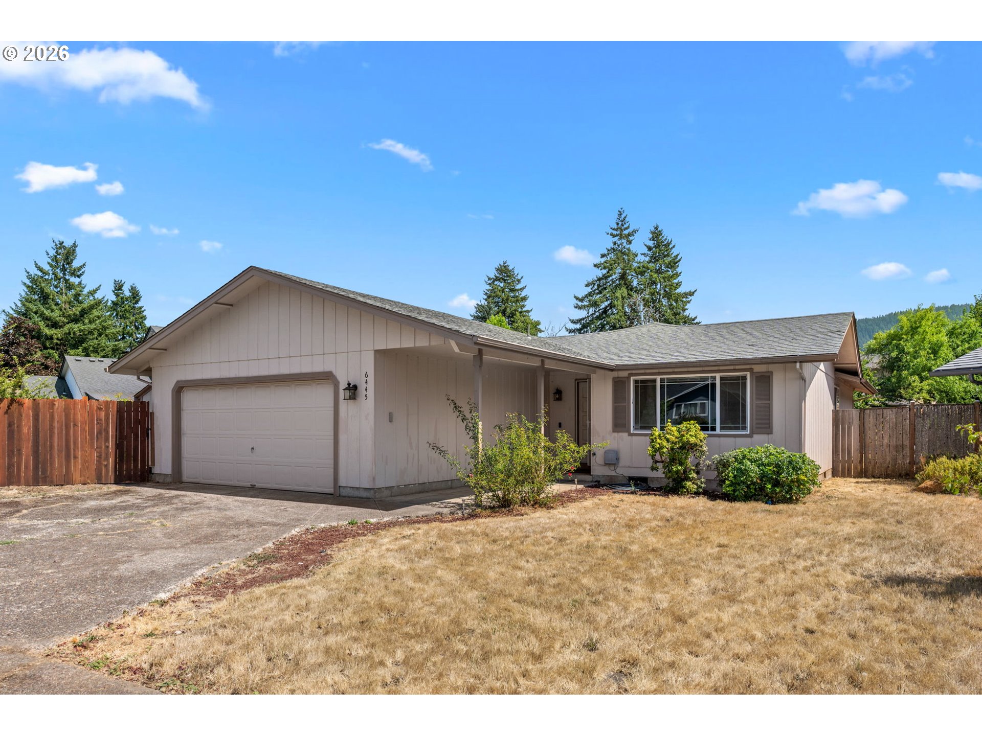 6445 B Street Springfield, OR 97478 - Photo 2 of 26 a view of a house with a yard