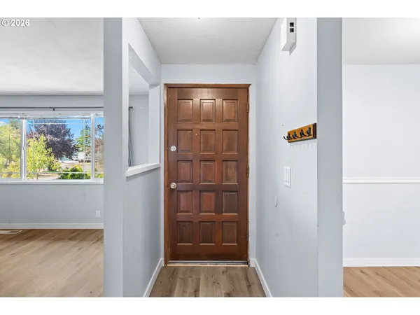 a view of walk in closet with wooden floor