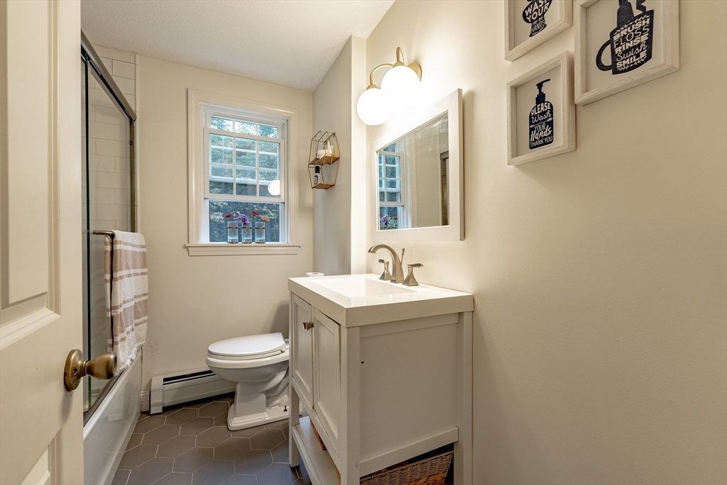 24 Rambling Drive Westfield, MA 01085 - Photo 20 of 39 a bathroom with a sink toilet and window