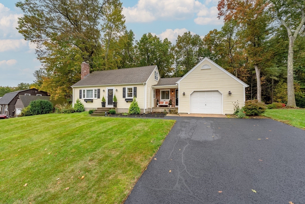 24 Rambling Drive Westfield, MA 01085 - Photo 2 of 39 a view of a white house next to a yard with big trees