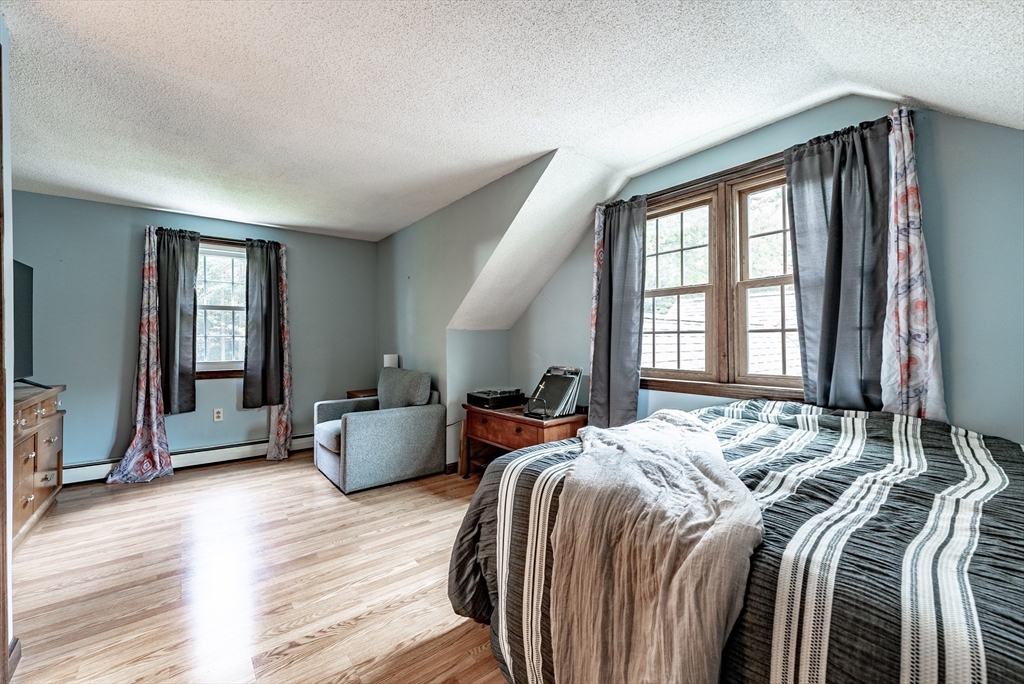 24 Rambling Drive Westfield, MA 01085 - Photo 23 of 39 a bedroom with a bed and wooden floor