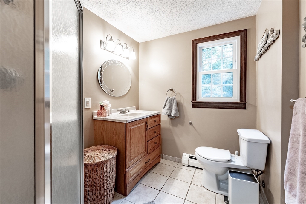 24 Rambling Drive Westfield, MA 01085 - Photo 24 of 39 a bathroom with a toilet sink and mirror