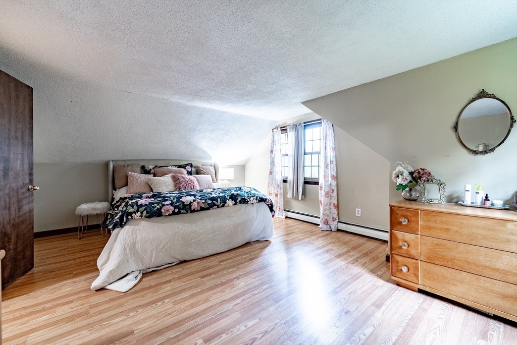 24 Rambling Drive Westfield, MA 01085 - Photo 25 of 39 a bedroom with a bed and wooden floor