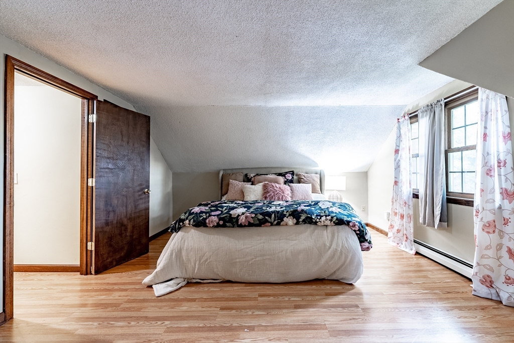 24 Rambling Drive Westfield, MA 01085 - Photo 26 of 39 a bedroom with a bed and wooden floor