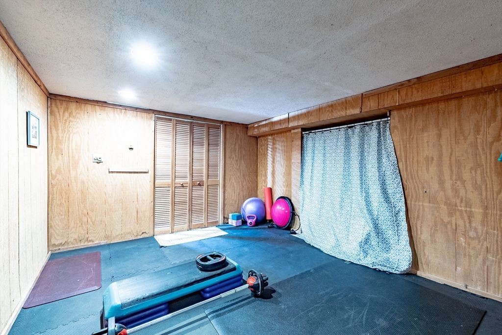 24 Rambling Drive Westfield, MA 01085 - Photo 29 of 39 a room with wooden floor and furniture