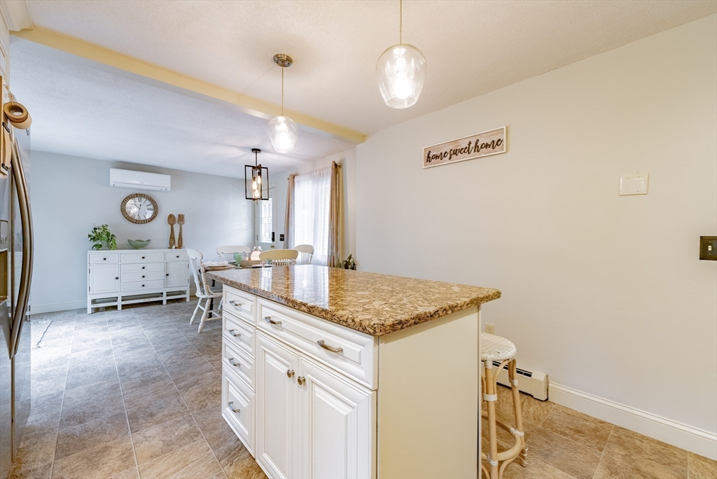 24 Rambling Drive Westfield, MA 01085 - Photo 5 of 39 a bathroom with a granite countertop sink a toilet and a mirror