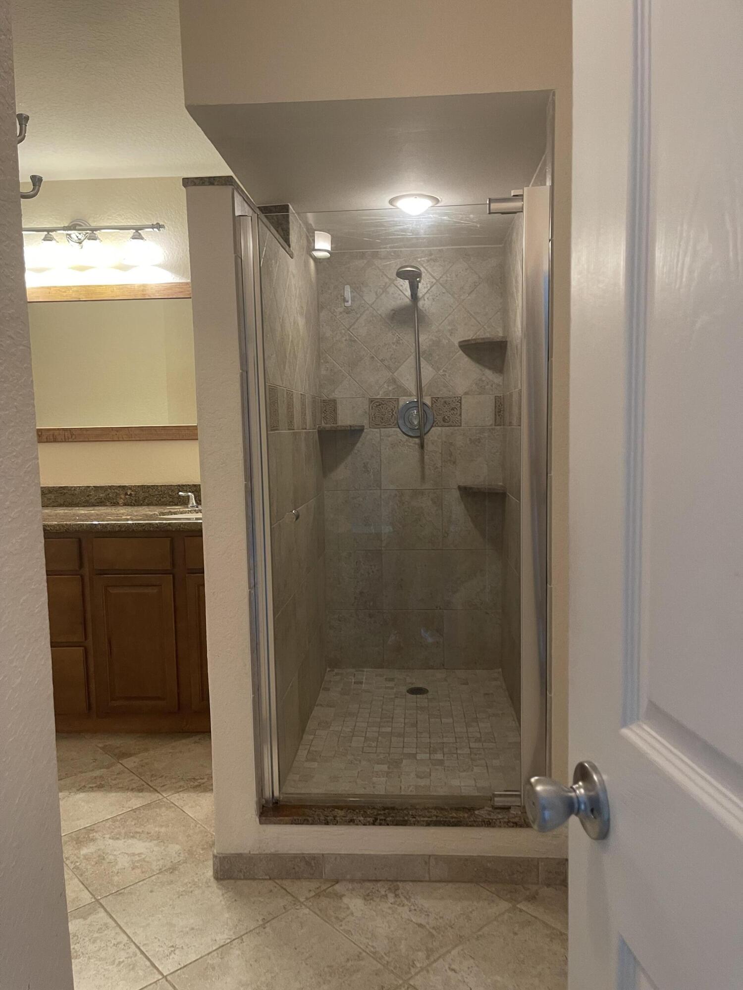 613 6th Lane Palm Beach Gardens, FL 33418 - Photo 12 of 12 a bathroom with a shower