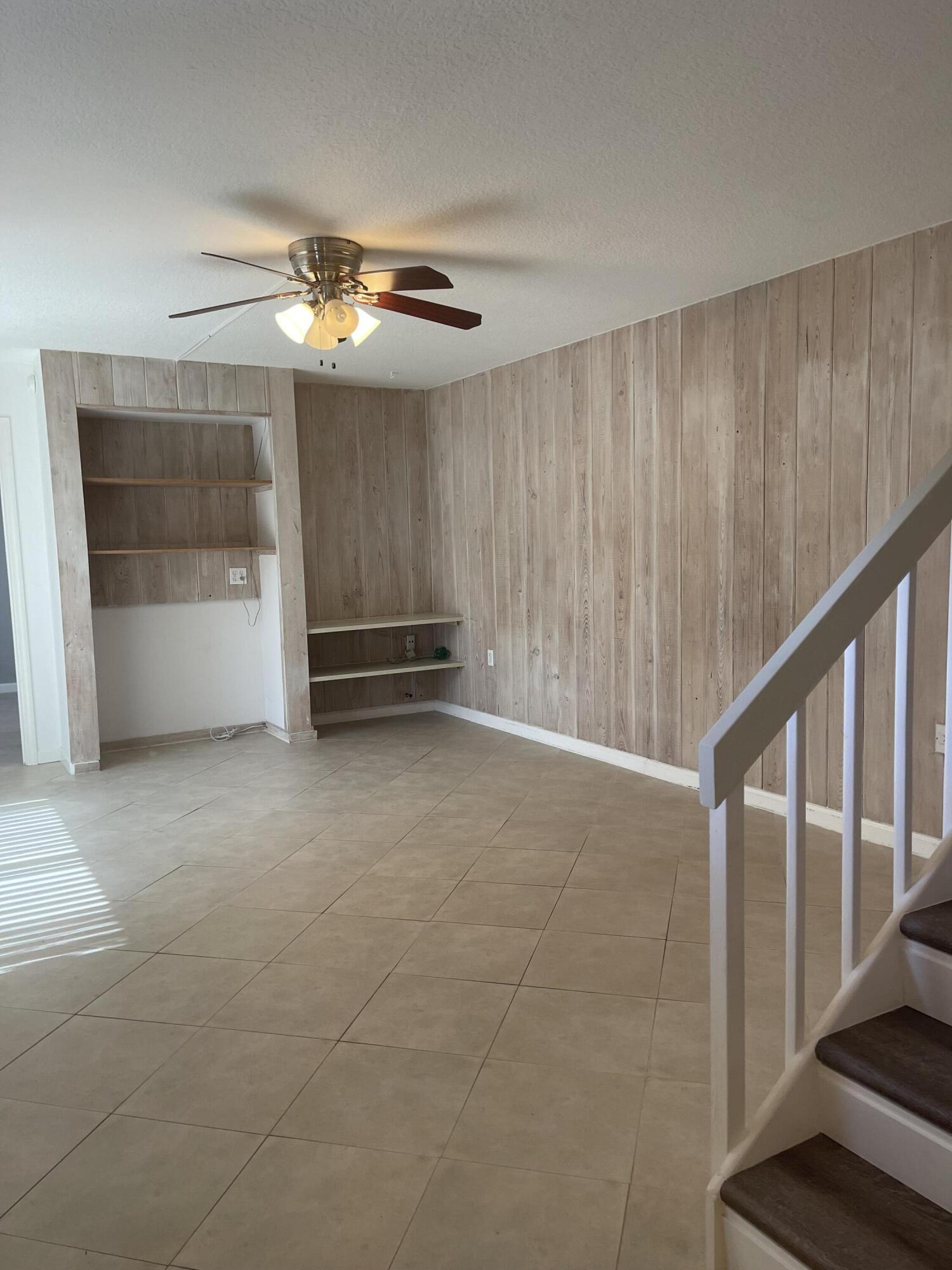 613 6th Lane Palm Beach Gardens, FL 33418 - Photo 5 of 12 a view of an empty room with a window