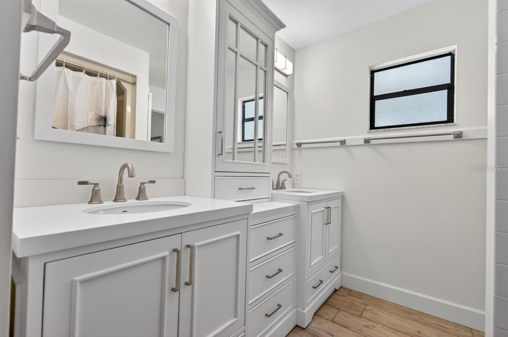 171 William Street Edgewater, FL 32141 - Photo 23 of 40 a spacious bathroom with a double vanity sink and a mirror