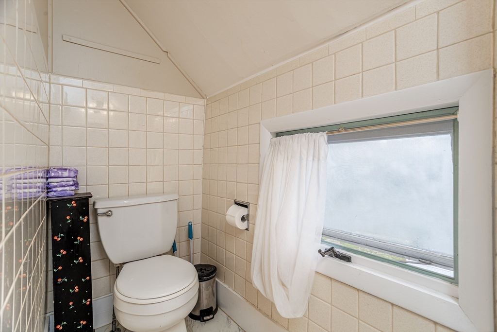 54 Charles Street Gardner, MA 01440 - Photo 28 of 40 a bathroom with a toilet and a shower