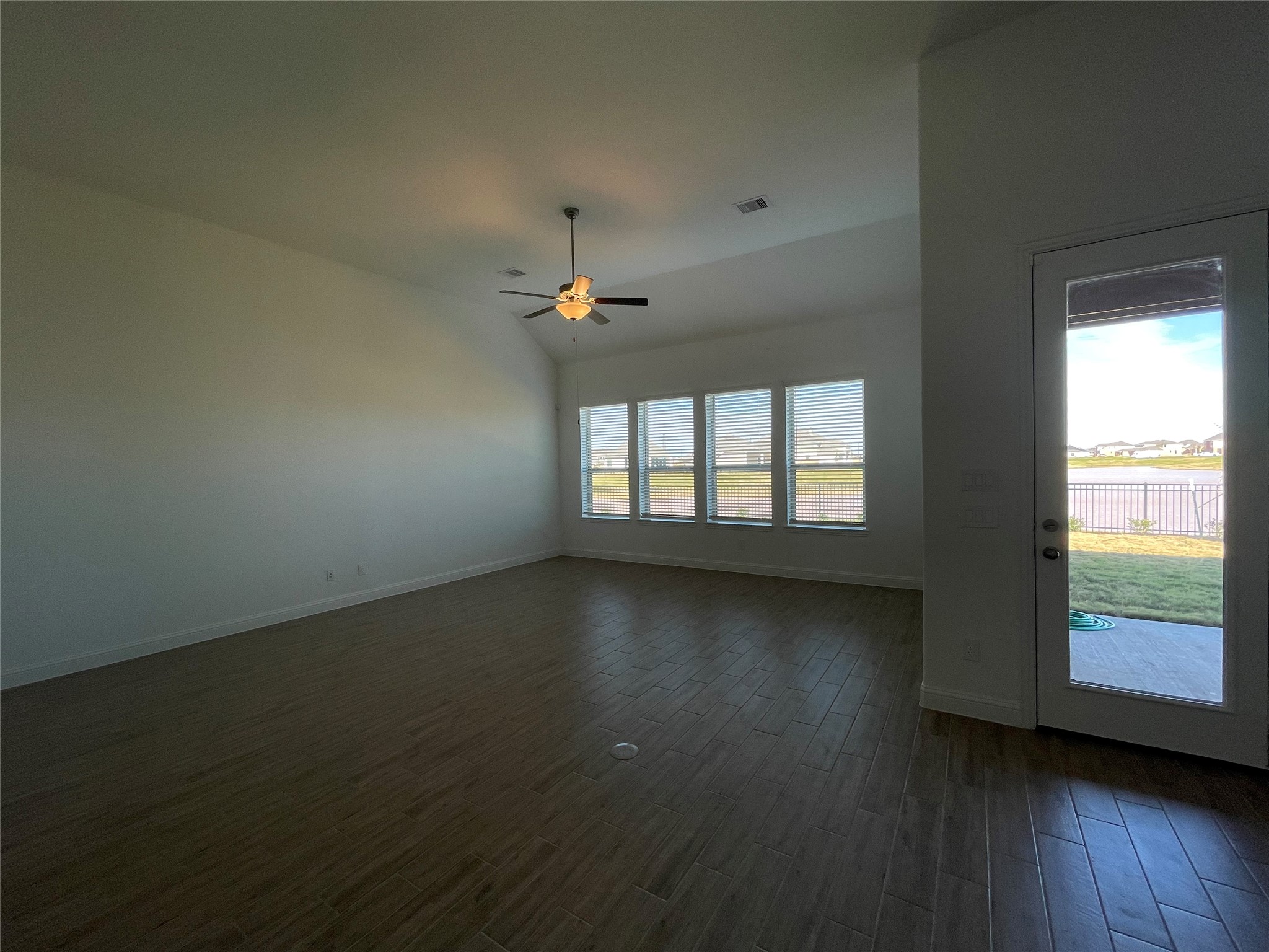 29806 Cherry Vine Road Katy, TX 77494 - Photo 25 of 30 an empty room with wooden floor and windows