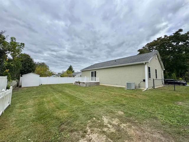 a backyard of a house with lots of green space
