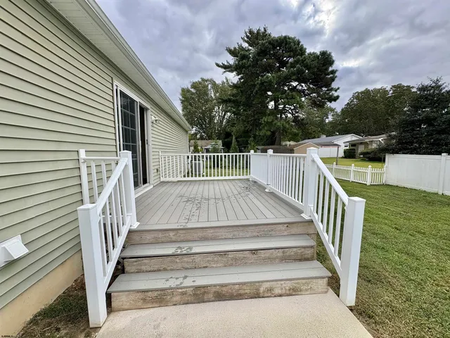 a view of entryway with wooden stairs