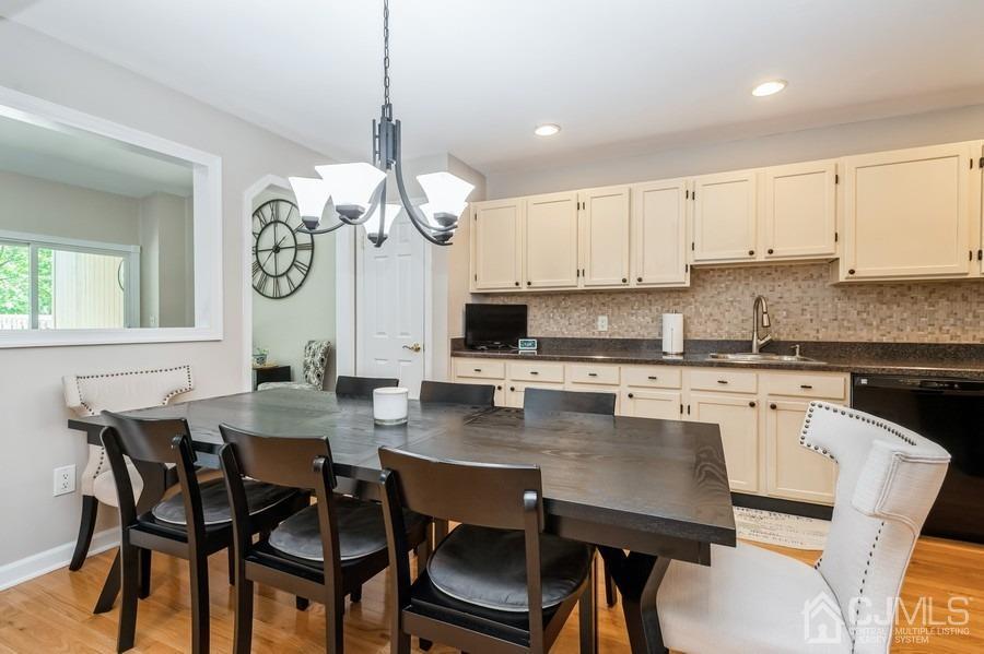 139 Redpine Loop Old Bridge, NJ 08857 - Photo 8 of 24 a view of a dining room with furniture and a chandelier