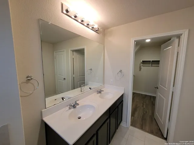 a en suite bathroom with a sink a toilet and shower
