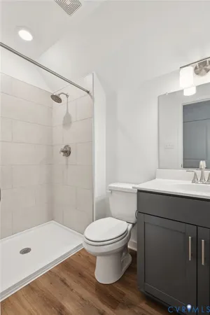 a view of a balcony with a floor to ceiling window and wooden floor